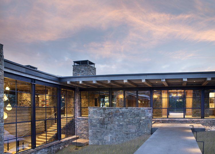 Optimum architectural steel windows and doors on a mountain home, manufacturer photo