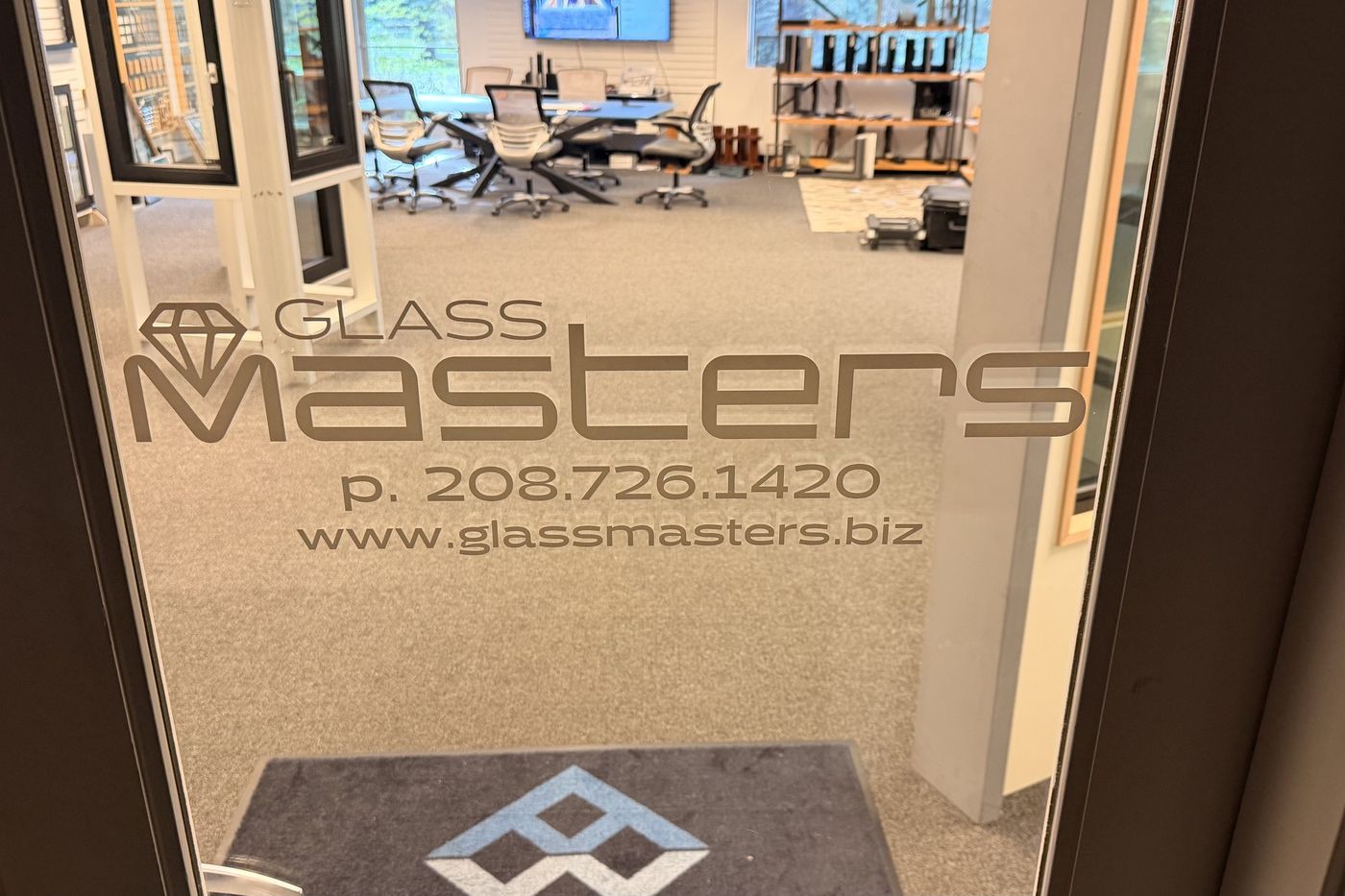 The glass entry door to the Glass Masters showroom